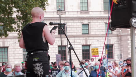NHS-worker-gives-speech-at-protest-in-London,-UK