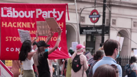Protesters-marching-down-London-street-for-NHS