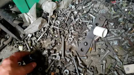 Sorting-through-assorted-nuts---bolts