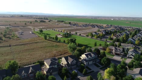 A-flight-over-suburban-Colorado-while-new-homes-are-built-in-the-background