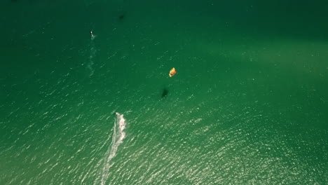 high-altitude-top-down-drone-shot-of-Kite-surfer-in-turquise-Atlantic-ocean