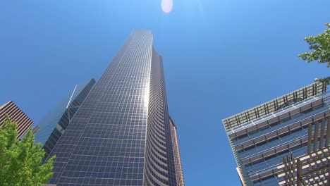 Driving-with-a-look-to-massive-and-modern-buildings-in-Seattle-and-blue-summer-sky