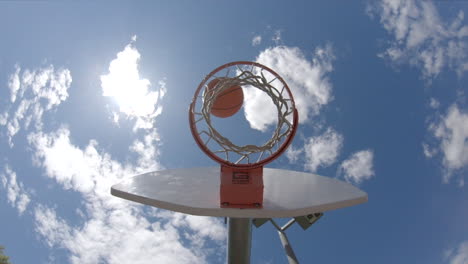 Basketball-game-unique-angle-of-ball-being-shot-into-hoop