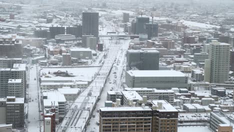 Beautiful-view-out-on-Sapporo-City-from-above,-covered-in-snow