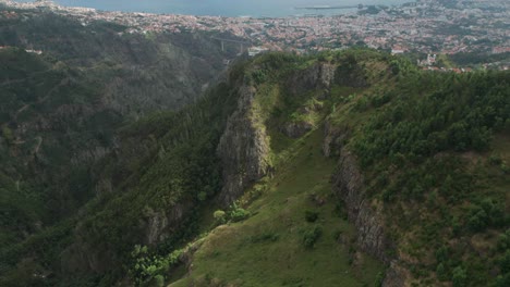 Aerial-view-of-city-Funchal-on-Madeira-island-seen-from-green-mountains