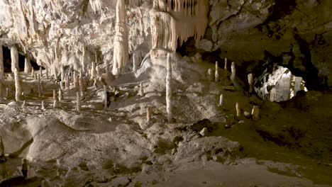 Postojna-caves-interior-pan-over-stalagmites-stalactites
