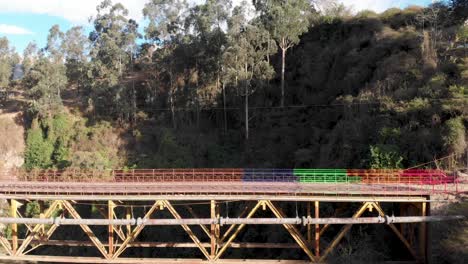 Dron-straight-fly-to-old-colored-bridge-of-Guambi-on-Ecuador