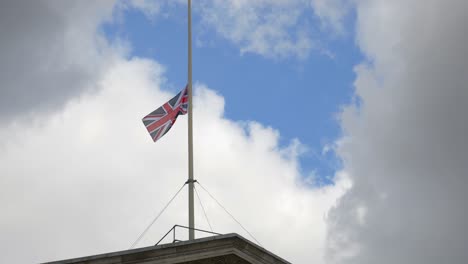 Long-shot-of-Union-Jack-flying-at-half-mast-on-top-of-the-Bank-of-England's-building's,-in-the-City-of-London