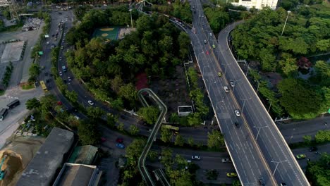 AERIAL-TILT-UP-Highway-Overpass-And-City-Reveal