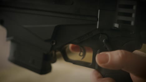 Shooter-switch-Ruger-rifle-safe-to-fire-mode-and-put-finger-on-trigger-close-up