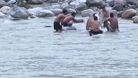 Freinds-enjoying-by-the-ghats-of-river-ganges-in-rishikesh-,-india
