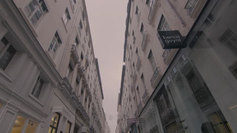 Walking-down-the-elegant-street-with-luxury-shops-in-Lyon,-France,-slow-motion