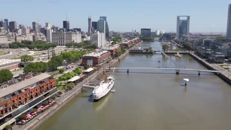 Aerial-establishing-shot-flying-over-Puerto-Madero-docks-in-Buenos-Aires-city-at-daytime
