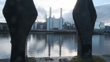 Pull-back-shot-of-battersea-power-station-under-repairs-revealing-thames-path-fence