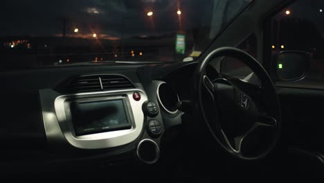 Close-up-on-dashboard-of-modern-Honda-car-at-night