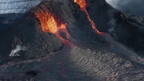 Magma-flows-from-crater-at-volcano-in-Iceland,-Pahoehoe-lava,-aerial