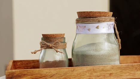 two-glass-jars-filled-with-sand-used-in-a-wedding-ritual