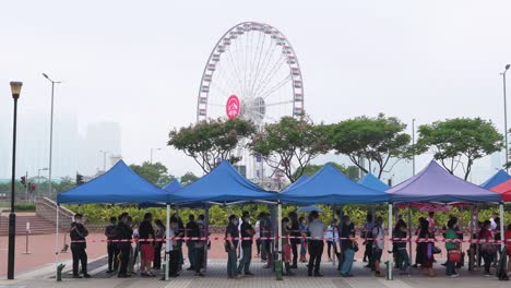 Chinese-citizens-queue-in-line-to-receive-mass-PCR-tests-for-coronavirus-from-Community-Testing-Centre-trucks-to-tackle-the-spread-of-the-virus-and-the-pandemic-in-Hong-Kong