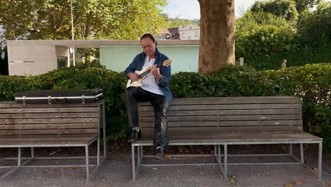 a-guitarist-got-on-a-bench-and-played-the-guitar
