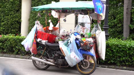 Static-shot-of-a-drinks-stall-mounted-on-a-motorcycle-in-southest-Asia