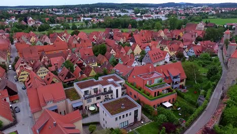 drone-descends-near-the-tower-on-the-wall-of-the-old-town-with-a-view-of-the-houses-and-the-red-roofs