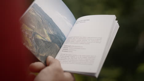 Brochure-and-the-hand-of-a-hiker