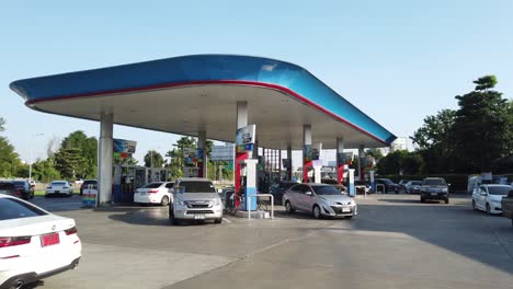 Cars-Passing-By-And-Refuelling-At-Gas-Station-In-Thailand-During-Daytime---real-time,-static-shot