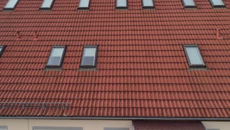 a-drone-flies-over-the-roof-of-a-house