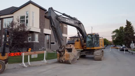 Excavator-and-machinery-in-residential-street-pan