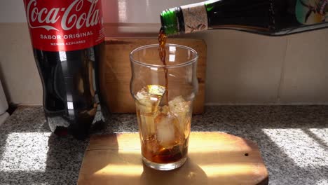 Pouring-Fernet-Branca-in-a-glass-with-ice-cubes