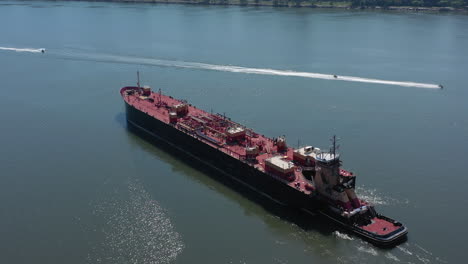 A-drone-view-of-a-large-red-barge-on-the-Hudson-River-in-NY