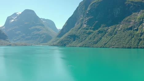 Beautiful-Scenery-Of-Turquoise-Blue-Water-Of-The-Lake-Amidst-The-Green-Landscape-Of-The-Mountains-In-Stryn,-Norway