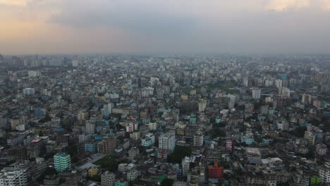 Vast-panoramic-aerial-view-of-an-urban-city,-establishing-drone-descending-shot