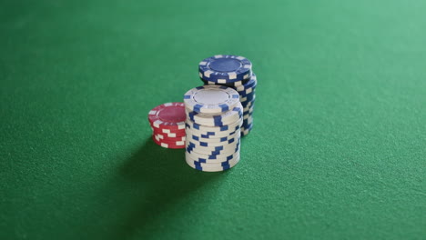 Pushing-stacks-of-poker-chips-all-in-on-table-at-casino