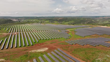 Aerial-shot-of-a-medium-sized-solar-farm-in-the-southern-Portuguese-countryside,-concept-for-sustainability-and-energy-independence
