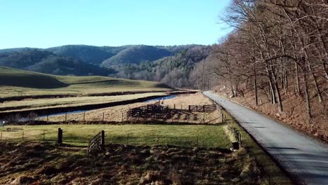 aerial-push-along-country-dirt-road,-life-in-the-country,-rural-life-in-the-mountains-near-boone-and-blowing-rock-nc,-north-carolina-farm-life,-country-music