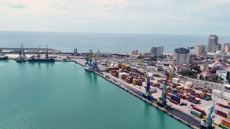 aerial-view-of-large-cargo-port-in-Durres,-Albania-near-the-adriatic-sea,-tracking-wide-shot