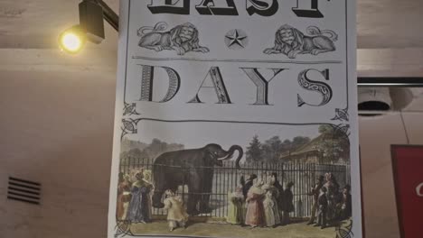 Old-historical-poster-chart-saying-"Last-Days"-and-showing-an-elephant-closed-in-a-London-zoo-with-people-outside-the-fence