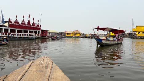 POV-From-A-Wooden-Boat-On-Lake-Nokoue-In-Ganvie-Village,-Benin,-West-Africa