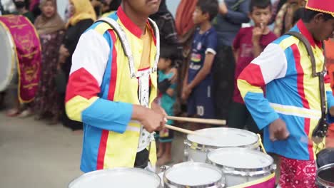 Drummers-in-a-marching-band-are-welcomed-by-the-audience-at-an-arts-and-culture-event-or-carnival