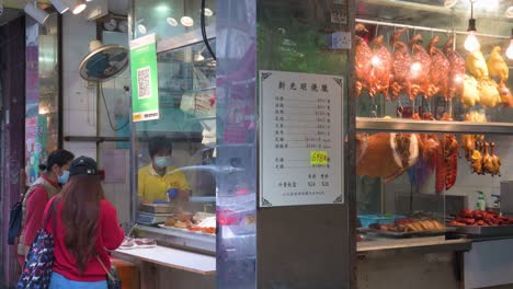 Einwohner-Kaufen-Mittagsmahlzeiten-In-Einem-Grillrestaurant-Im-Hongkong-Stil-In-Hongkong