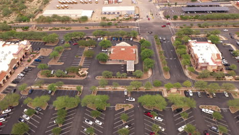 Static-drone-shot-of-shopping-mall-parking-lot-in-Southern-Arizona