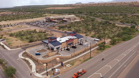 Mister-Car-Wash,-exterior-building-in-Southern-Arizona,-drone-orbit