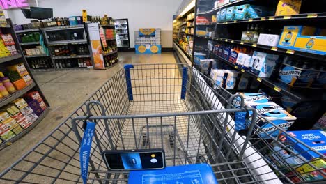 POV-while-pushing-a-cart-through-Walmart-past-the-alcoholic-beverages