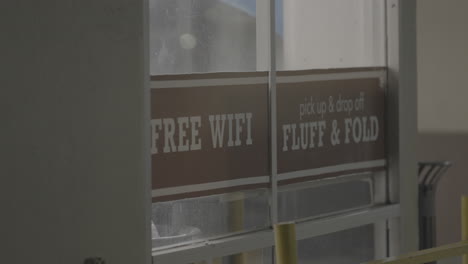 Video-of-the-gate-of-the-laundromat-Fluff-and-Fold-with-a-signboard-which-states-free-Wi-Fi-and-pick-up-and-drop-off-facility-provide-in-the-laundromat-in-Los-Angeles