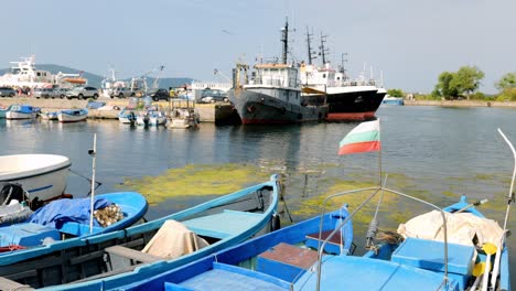 Bulgarian-flag-flying-on-small-fishing-boat-in-sozopol-harbour-black-sea