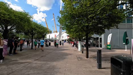 Hyperlapse-towards-O2-Arena-in-London,-Pov-walking-through-people-in-O2-Arena-Surroundings