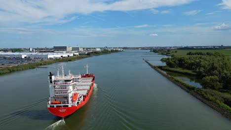 Aerial-Ascending-From-Stern-Of-A2B-Proud-Cargo-Ship-Sailing-Along-Oude-Maas-In-Zwijndrecht