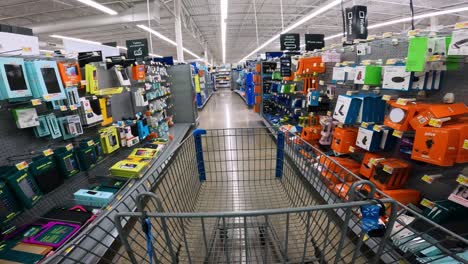 POV-while-pushing-a-cart-through-Walmart-in-electronics-section,-specifically-cell-phones-and-cables