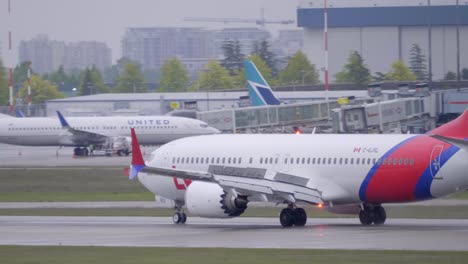 Boeing-737-Max-on-the-Runway-at-the-Airport,-Tracking-Shot